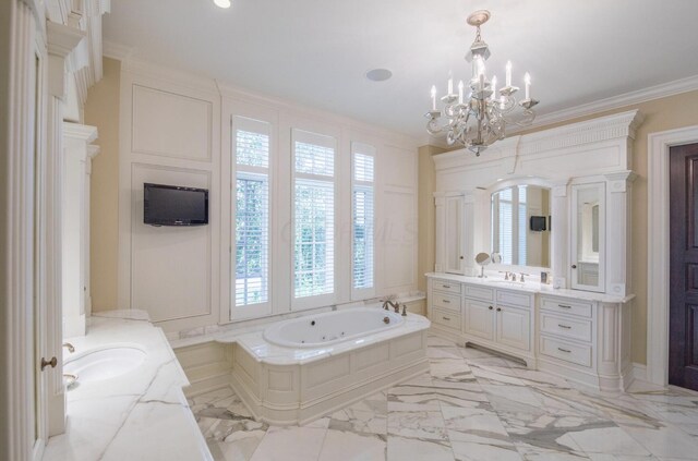 bathroom with crown molding, an inviting chandelier, marble finish floor, a whirlpool tub, and two vanities
