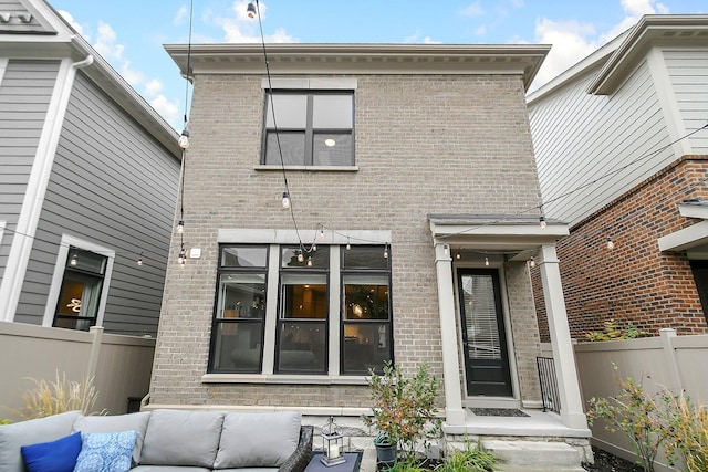 935 Pullman Pl, Columbus, OH 43212 - rear view of property featuring brick siding, an outdoor living space, and fence