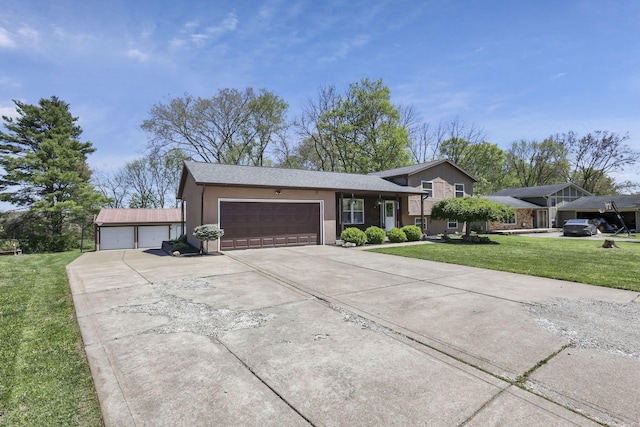 split level home featuring a garage, a front lawn, stucco siding, and driveway
