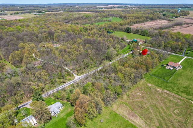 aerial view featuring a view of trees