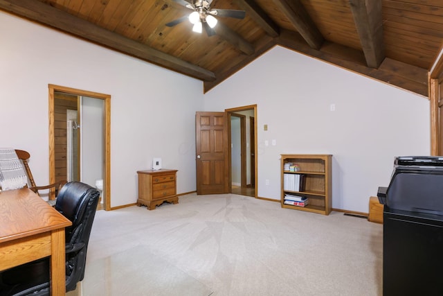 office space featuring ceiling fan, light colored carpet, lofted ceiling with beams, baseboards, and wood ceiling