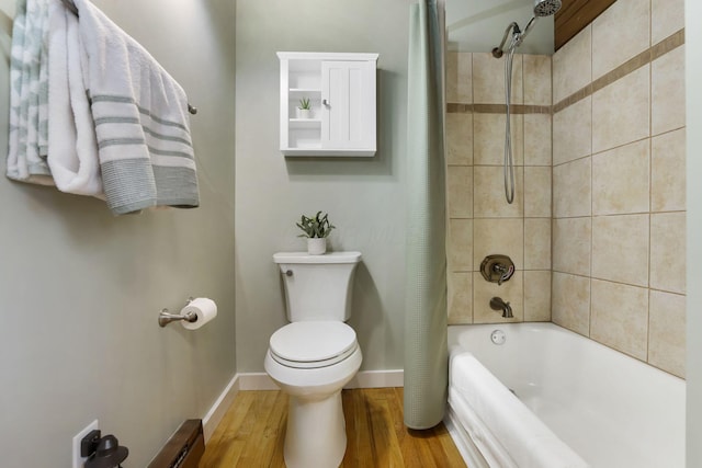 full bathroom with baseboards, shower / bathtub combination with curtain, toilet, and wood finished floors