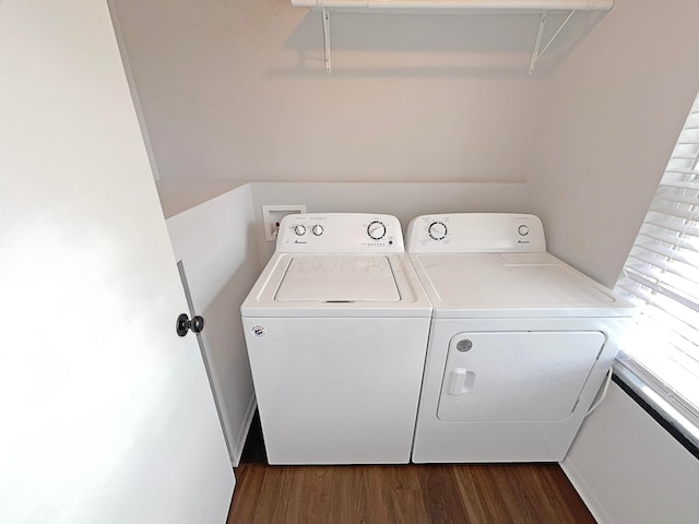 clothes washing area with separate washer and dryer, laundry area, and dark wood-style flooring