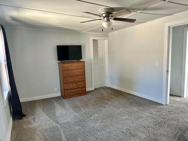 unfurnished bedroom featuring baseboards, a ceiling fan, and carpet floors