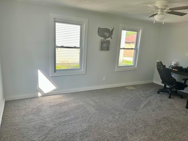 office space featuring carpet, visible vents, crown molding, and a textured ceiling