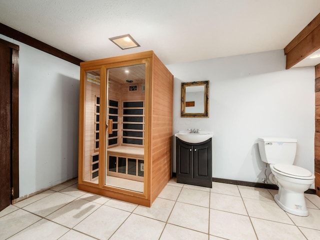bathroom with vanity, tile patterned floors, and toilet