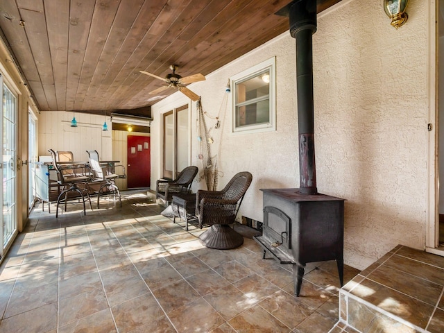 exterior space with ceiling fan