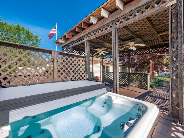 deck with ceiling fan and hot tub deck surround