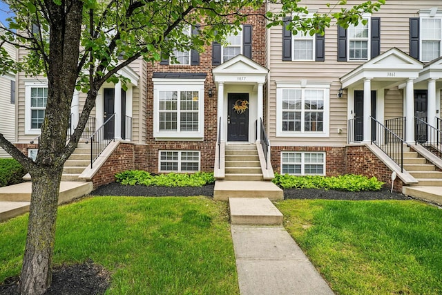 3857 Dowitcher Ln, Columbus, OH 43230 - view of property with a front yard and brick siding