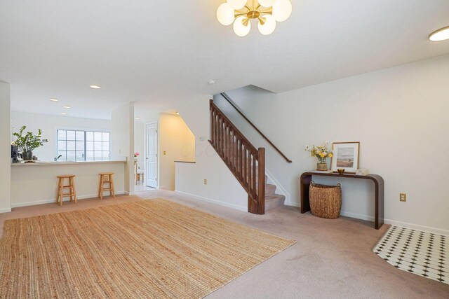 3857 Dowitcher Ln, Columbus, OH 43230 - unfurnished living room featuring stairs, a chandelier, carpet, baseboards, and recessed lighting