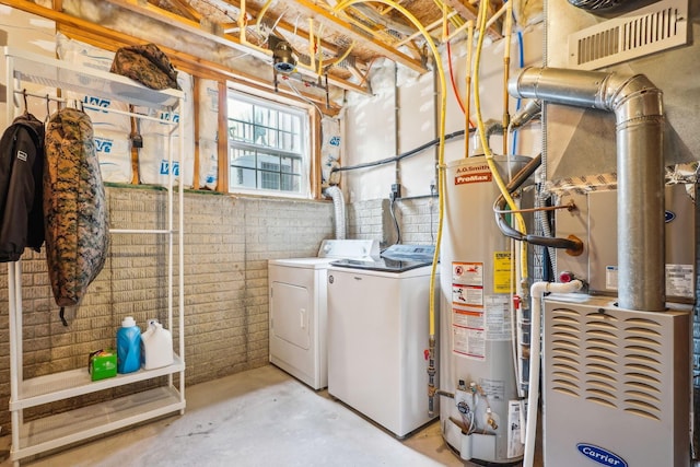 3857 Dowitcher Ln, Columbus, OH 43230 - clothes washing area with gas water heater, separate washer and dryer, and heating unit