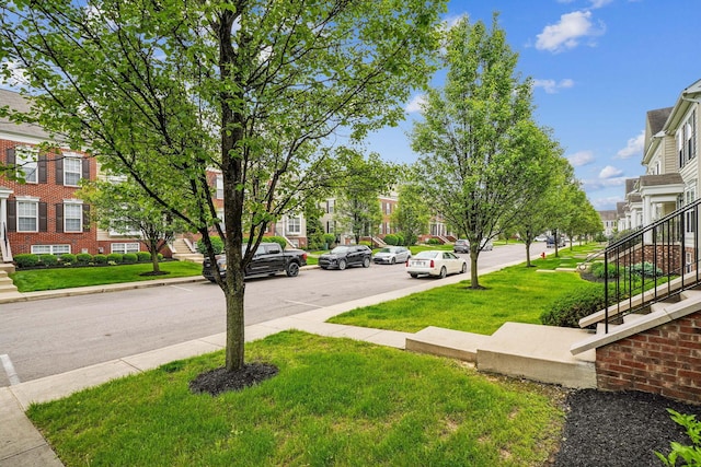3857 Dowitcher Ln, Columbus, OH 43230 - view of asphalt road with sidewalks, stairs, curbs, and a residential view
