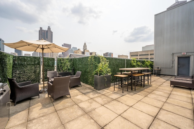 60 E Spring St Unit 215, Columbus, OH 43215 - view of patio featuring an outdoor living space, outdoor dining area, and a fenced backyard