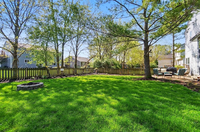 5694 Danmar Dr, Canal Winchester, OH 43110 - view of yard featuring an outdoor living space with a fire pit, a patio, and a residential view