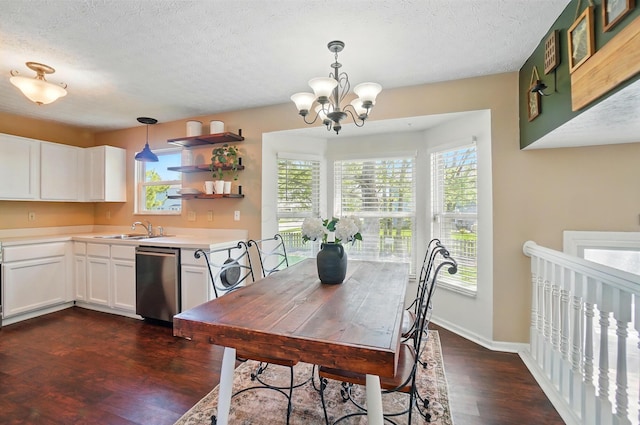 5694 Danmar Dr, Canal Winchester, OH 43110 - dining space with dark wood-style flooring, a textured ceiling, and a chandelier