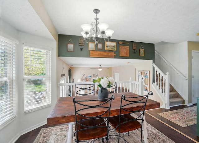 5694 Danmar Dr, Canal Winchester, OH 43110 - dining area with wood finished floors, a chandelier, stairs, and baseboards