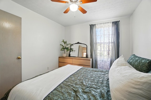 5694 Danmar Dr, Canal Winchester, OH 43110 - bedroom with a ceiling fan and a textured ceiling