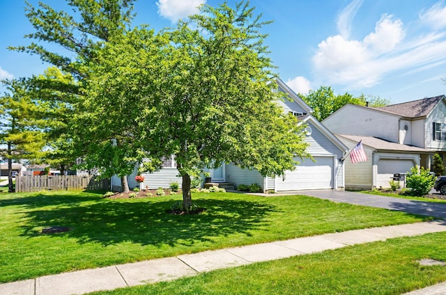 5694 Danmar Dr, Canal Winchester, OH 43110 - view of property hidden behind natural elements featuring driveway and a garage
