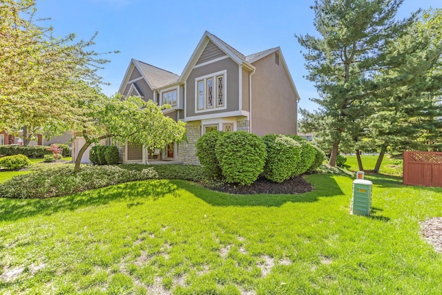 view of home's exterior featuring stucco siding and a yard