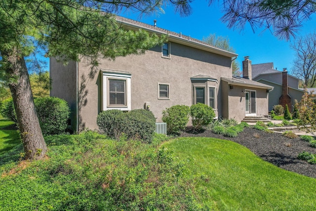 view of property exterior featuring stucco siding and cooling unit