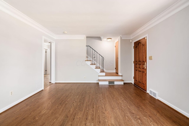 unfurnished living room with visible vents, ornamental molding, stairs, baseboards, and dark wood finished floors