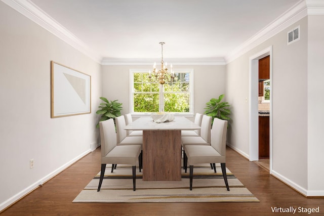 dining room featuring a healthy amount of sunlight, baseboards, visible vents, and a chandelier