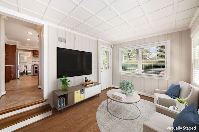 living area featuring crown molding, visible vents, baseboards, recessed lighting, and dark wood finished floors