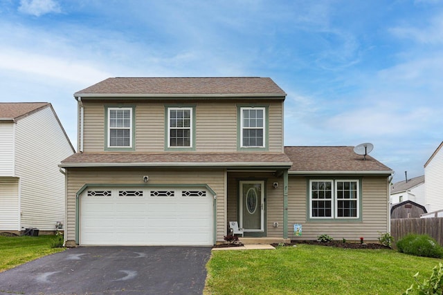 380 Oak Village Dr, Columbus, OH 43207 - traditional home with asphalt driveway and a garage