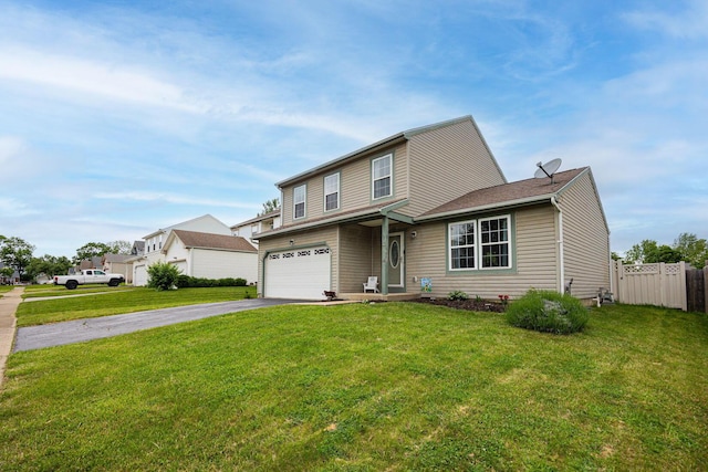380 Oak Village Dr, Columbus, OH 43207 - traditional-style house featuring asphalt driveway and an attached garage