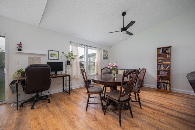 380 Oak Village Dr, Columbus, OH 43207 - dining area featuring light wood-type flooring, vaulted ceiling, baseboards, ceiling fan, and a textured ceiling