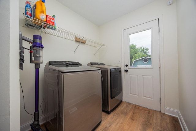 380 Oak Village Dr, Columbus, OH 43207 - laundry room featuring independent washer and dryer and wood finished floors