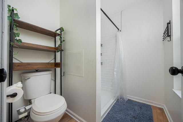 380 Oak Village Dr, Columbus, OH 43207 - full bath featuring toilet, wood finished floors, a stall shower, and baseboards
