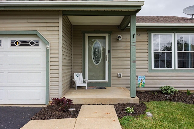 380 Oak Village Dr, Columbus, OH 43207 - view of exterior entry with roof with shingles and an attached garage