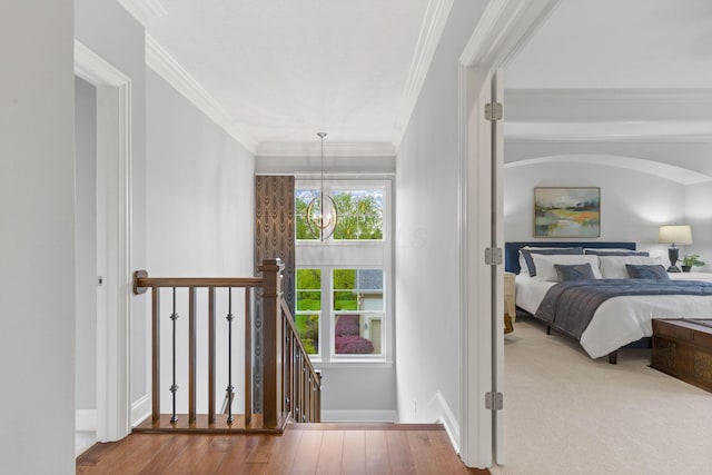 bedroom with crown molding and baseboards