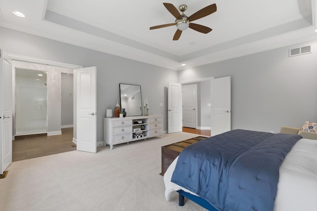 carpeted bedroom featuring ceiling fan, visible vents, a raised ceiling, baseboards, and recessed lighting