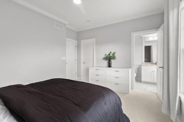 bedroom with connected bathroom, light colored carpet, a sink, visible vents, and ornamental molding