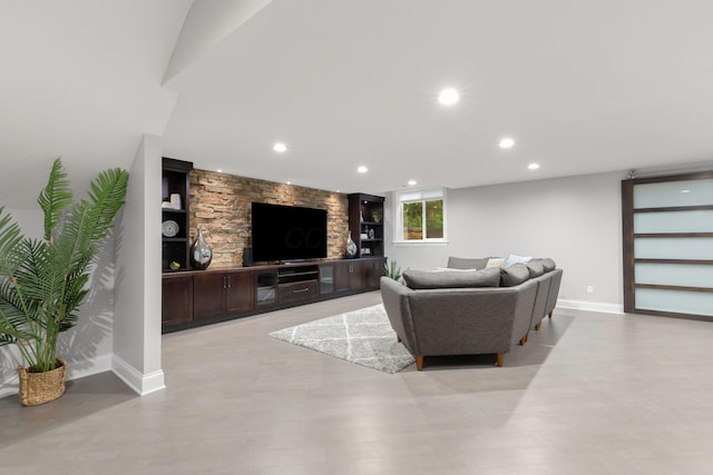 living area with baseboards and recessed lighting