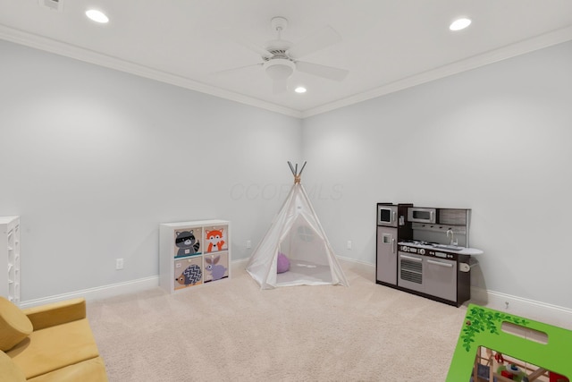 recreation room with baseboards, ornamental molding, a ceiling fan, and recessed lighting