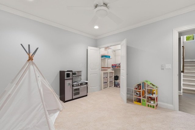 game room with carpet flooring, recessed lighting, ceiling fan, and ornamental molding