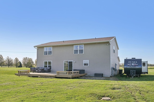 rear view of house with a deck, an outdoor hangout area, and a lawn