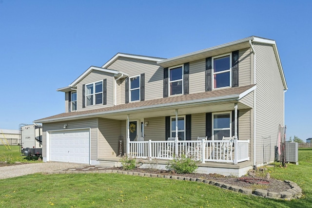 traditional-style home with driveway, covered porch, a front lawn, and a garage