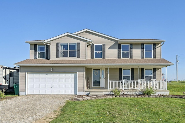 traditional-style home featuring covered porch, a garage, gravel driveway, and a front lawn