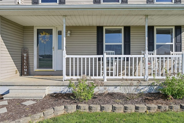 doorway to property featuring covered porch