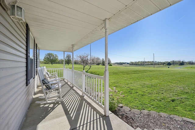 view of patio with a rural view and covered porch