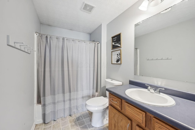 bathroom with a textured ceiling, visible vents, shower / tub combo with curtain, toilet, and vanity
