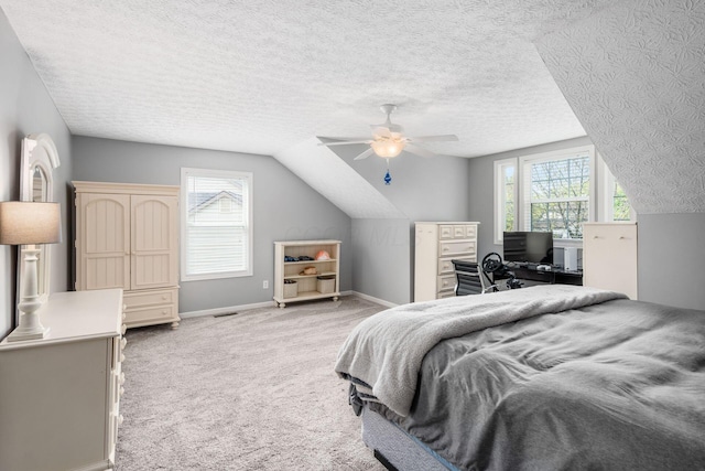 bedroom with light carpet, baseboards, vaulted ceiling, and multiple windows