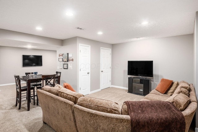 living room with visible vents, light colored carpet, and recessed lighting