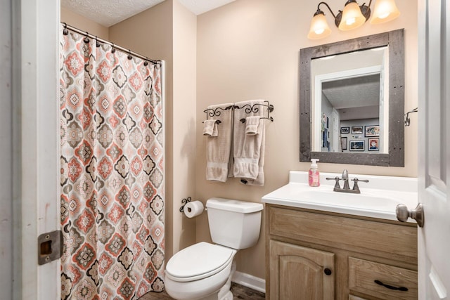 bathroom featuring toilet, a shower with curtain, and vanity