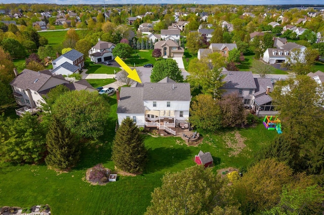 birds eye view of property with a residential view