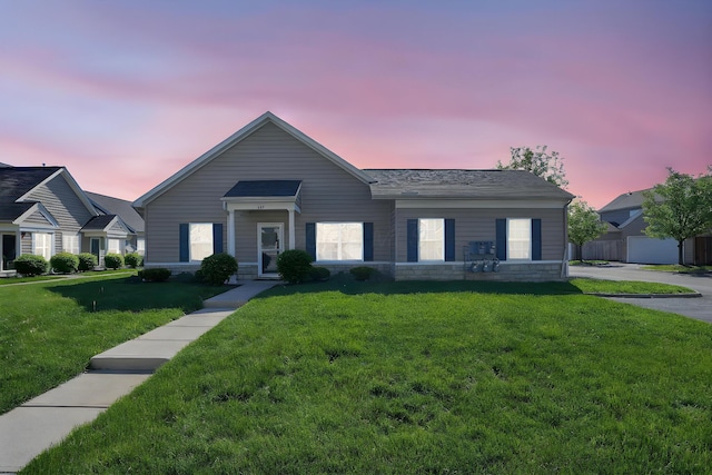 view of front of house with a yard